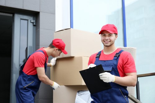 Removal van team in South Kensington handling recyclable moving materials