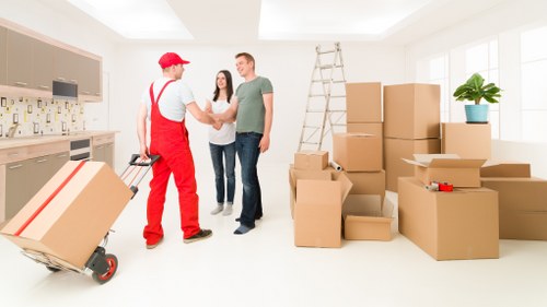 Careful furniture wrapping and unloading during a South Kensington move