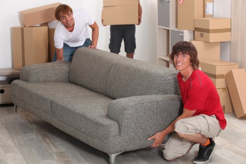 Team handling furniture loading with care during relocation