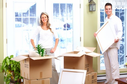 Careful moving of boxes and household items in South Kensington